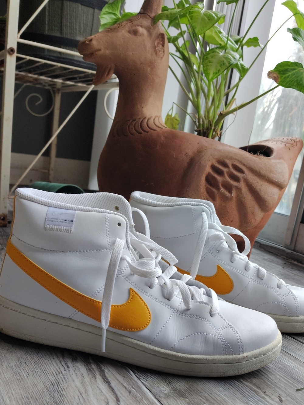 Nike White High-Top Sneakers with Yellow Swoosh